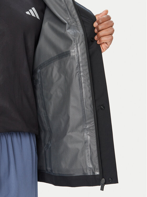 adidas adidas Demisezoninė striukė Essentials KS7695 Juoda Loose Fit