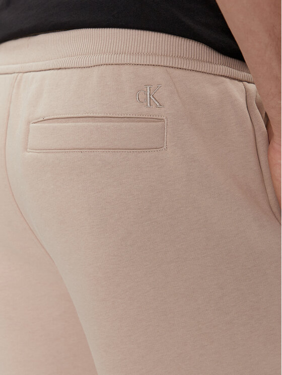 Calvin Klein Jeans Calvin Klein Jeans Spodnie dresowe Monologo J30J324685 Beżowy Regular Fit