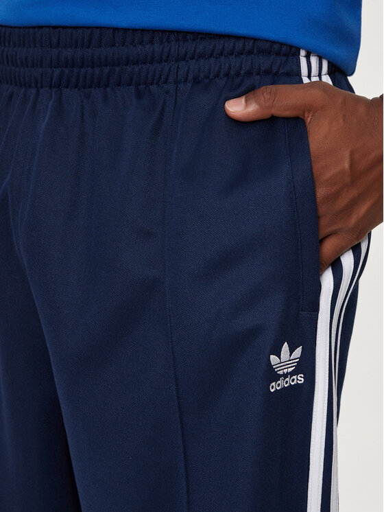adidas adidas Melegítő alsó adicolor Firebird IZ2466 Sötétkék Baggy Fit