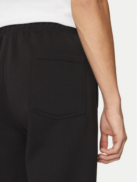Champion Champion Spodnji del trenirke 220434 Črna Loose Fit