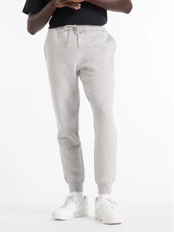 New Balance New Balance Spodnie dresowe MP43904AG Szary Standard Fit