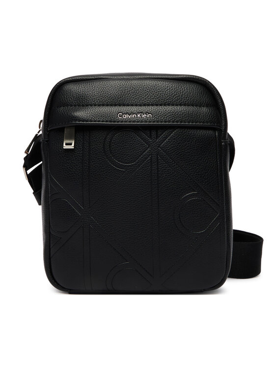 Calvin Klein Calvin Klein Brašna Emblem Aop Emboss Reporter LV04D3331G Černá