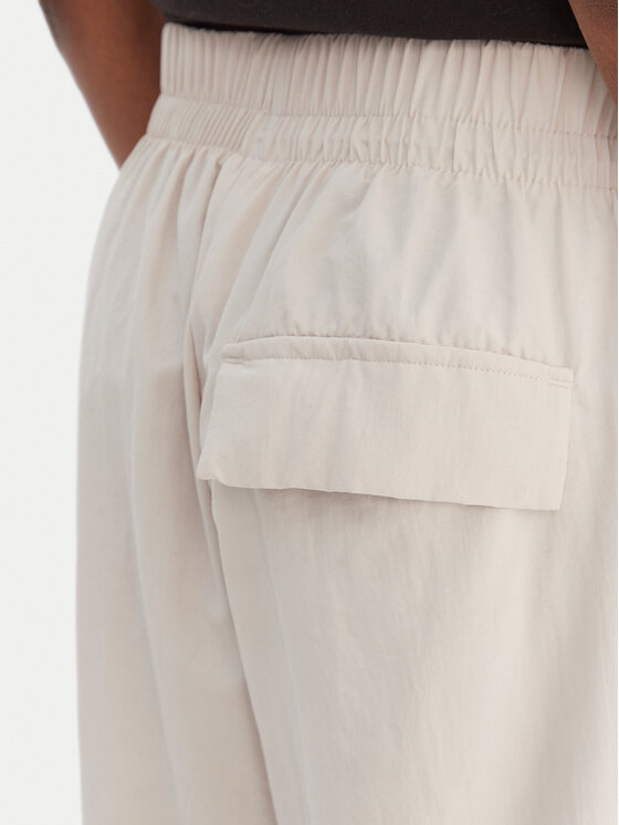 adidas adidas Pantaloni da tuta Essentials 3-Stripes JC8168 Beige Loose Fit