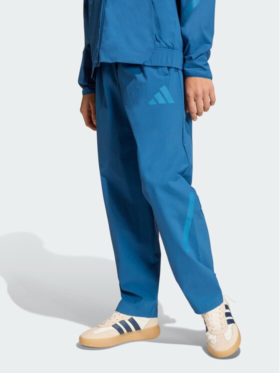 adidas adidas Spodnie materiałowe 163084 Niebieski Loose Fit