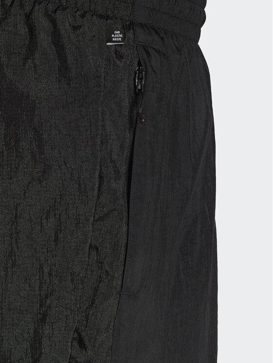 adidas adidas Spodnie dresowe Reveal Material Mix HK2732 Czarny Regular Fit