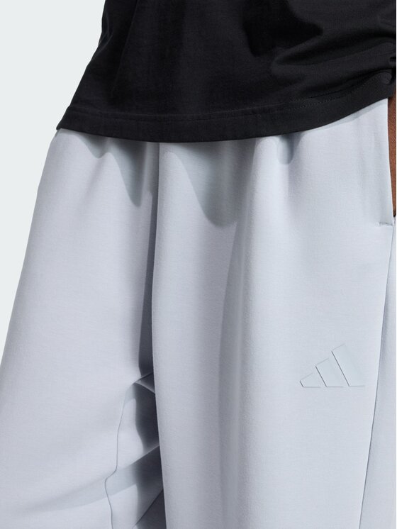 adidas adidas Spodnie materiałowe Soft Lux Straight Szary Loose Fit