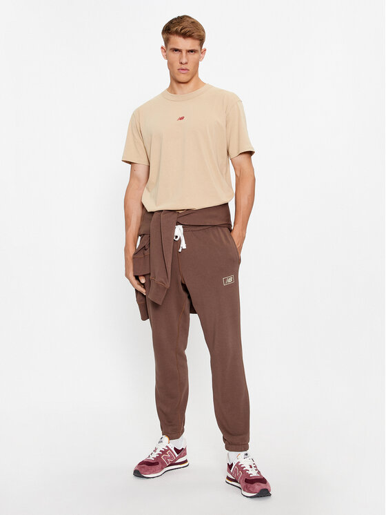 New Balance New Balance Долнище анцуг NB Essentials Sweatpant MP33509 Кафяв Regular Fit