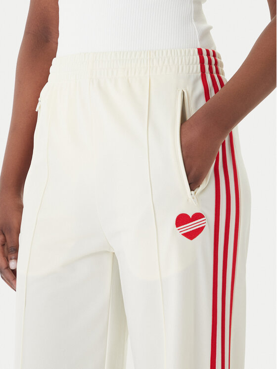 adidas adidas Spodnie dresowe Firebird KQ8056 Beżowy Loose Fit