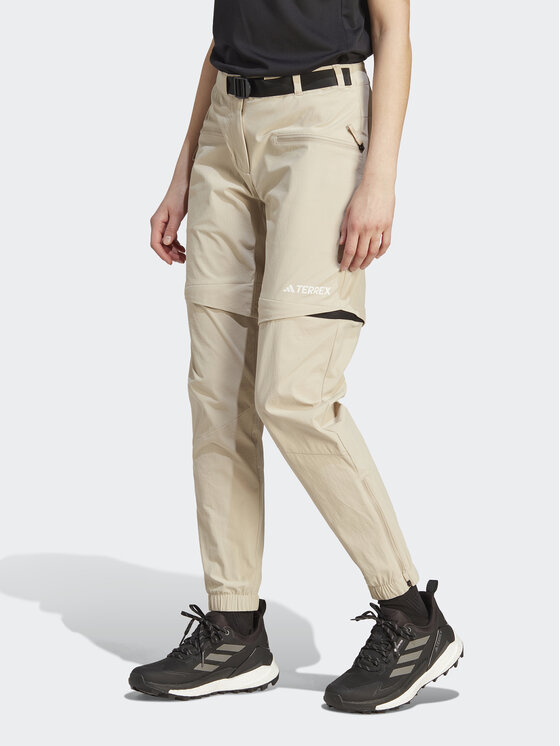 adidas Teplákové nohavice Terrex Utilitas Hiking Zip-Off Tracksuit Bottoms HZ9046 Béžová Regular Fit
