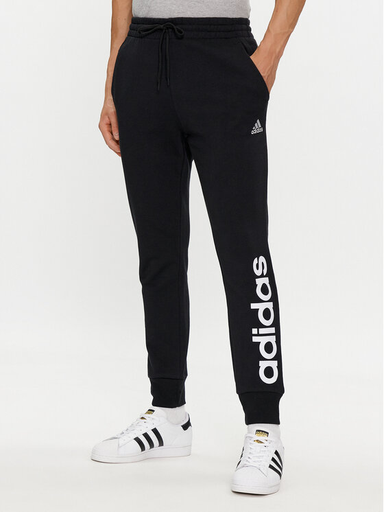 adidas Sporta bikses Essentials French Terry Tapered Cuff Logo Joggers IC0063 Melns Regular Fit