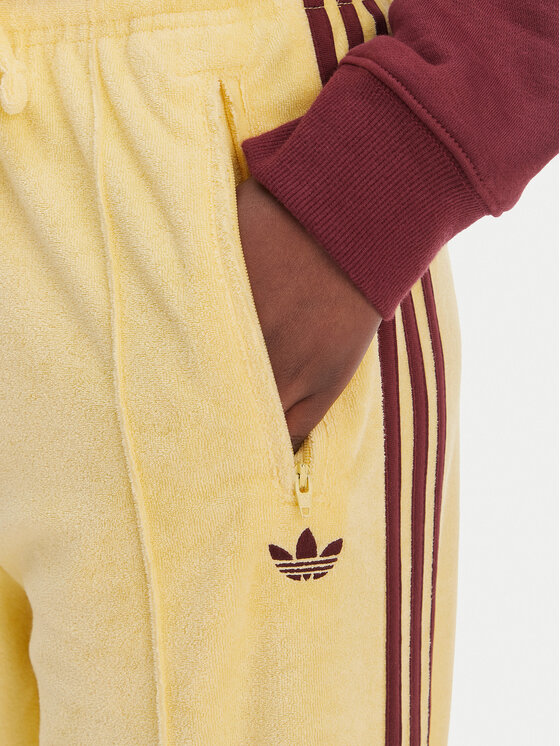 adidas adidas Spodnie dresowe Terry Towel Firebird KQ6662 Żółty Loose Fit