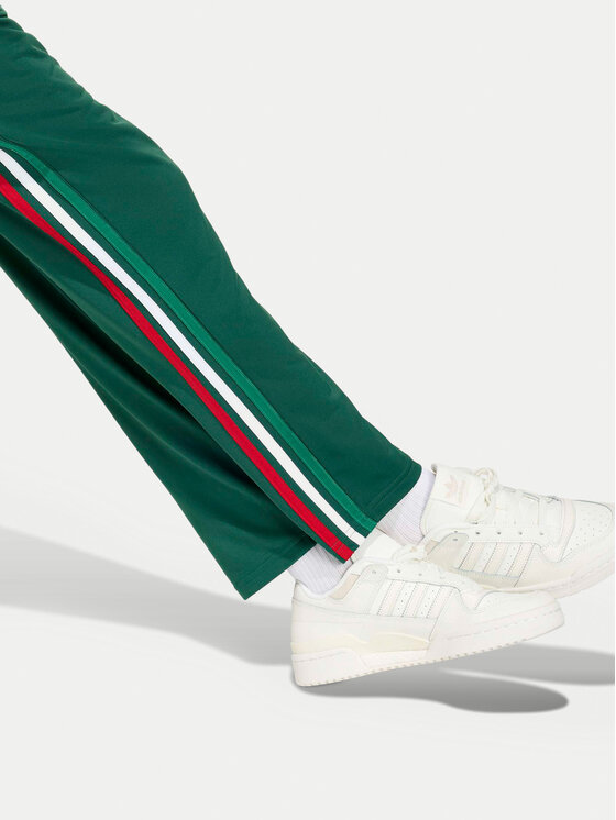 adidas adidas Spodnie dresowe Firebird KC9502 Zielony Regular Fit