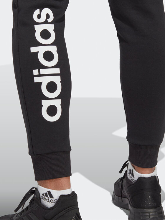 adidas adidas Spodnie dresowe Essentials Linear French Terry Cuffed Joggers IC6868 Czarny Slim Fit