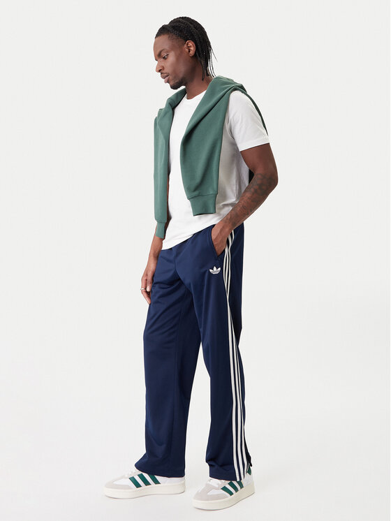 adidas adidas Spodnji del trenirke Firebird KD8316 Mornarsko modra Loose Fit