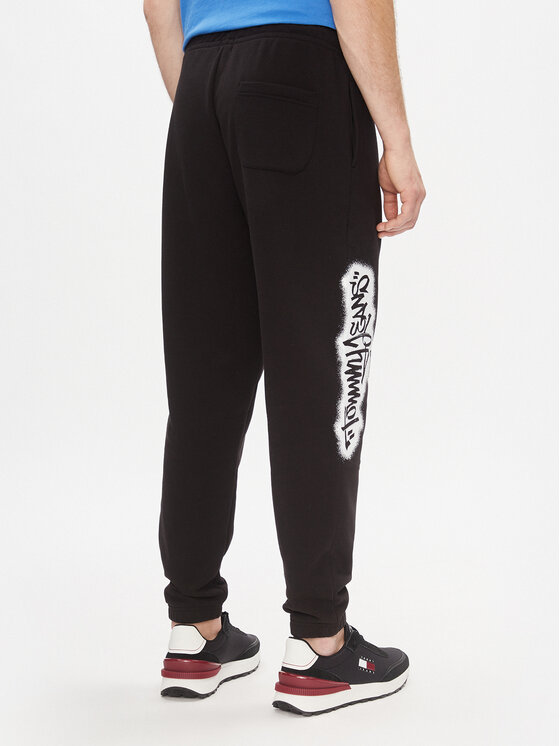 Tommy Jeans Tommy Jeans Donji dio trenerke Tjm Reg Tommy Spray Sweatpant DM0DM18376 Crna Regular Fit