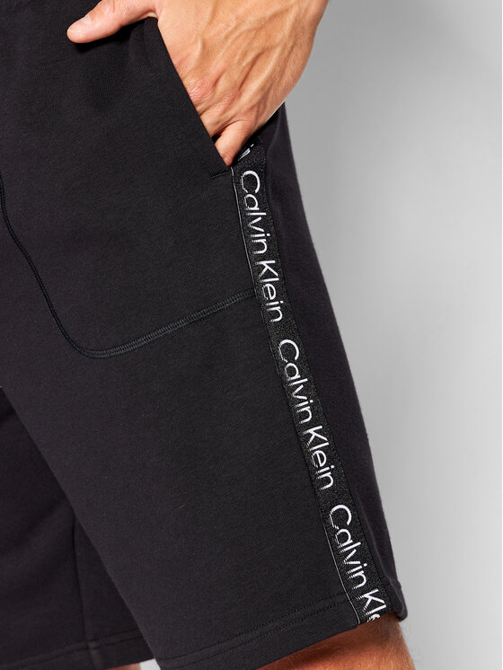 Kup online Calvin Klein Performance Legginsy sportowe z odblaskowym logo  (czarny)