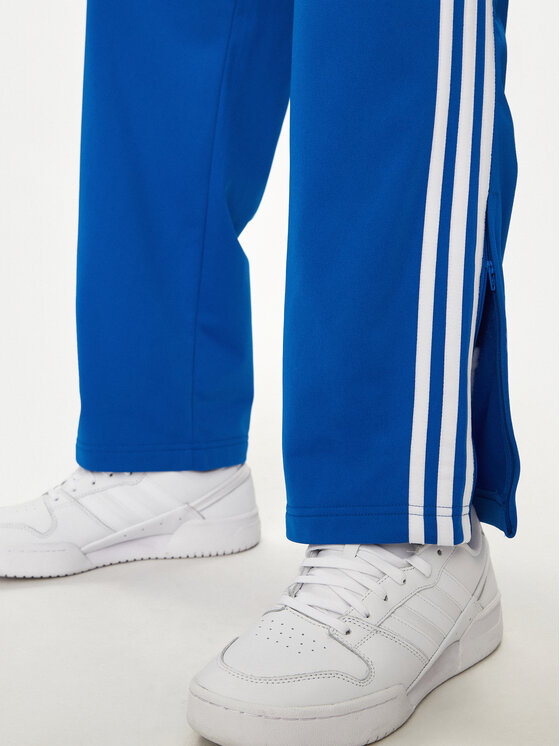 adidas adidas Спортивні штани adicolor Classics Firebird IJ7056 Голубий Regular Fit