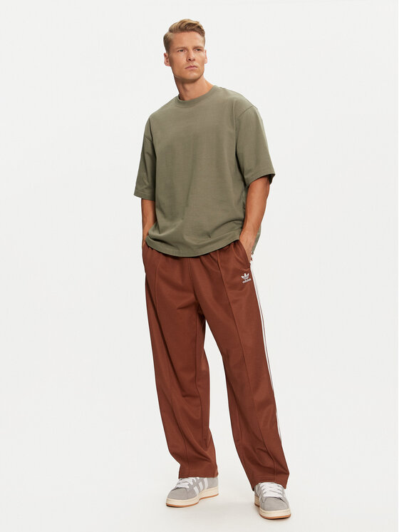 adidas Pantaloni da tuta adicolor Firebird IZ2476 Marrone Baggy Fit Modivo