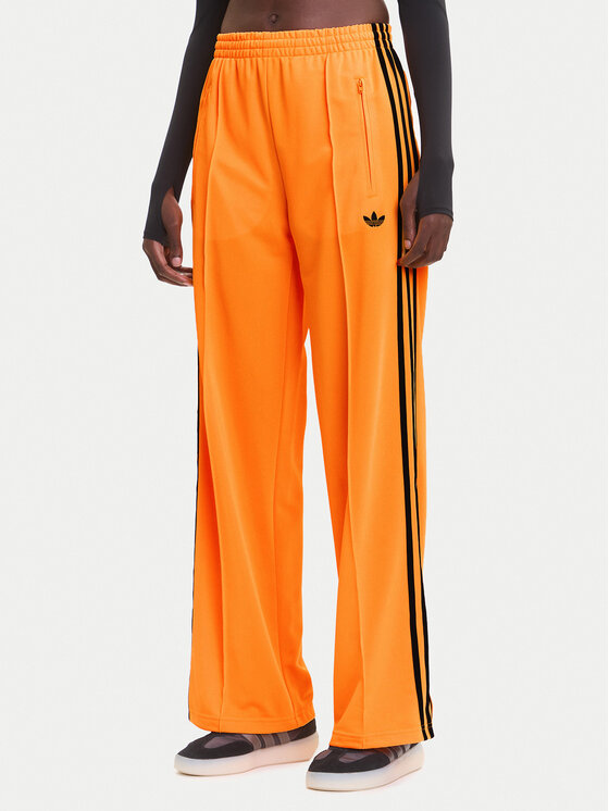 adidas Spodnie dresowe adicolor Classic Firebird JY2694 Żółty Loose Fit