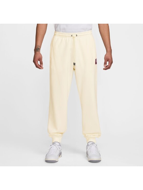 Nike Nike Spodnie dresowe Brooklyn Fleece Graphic Pants Beżowy Regular Fit