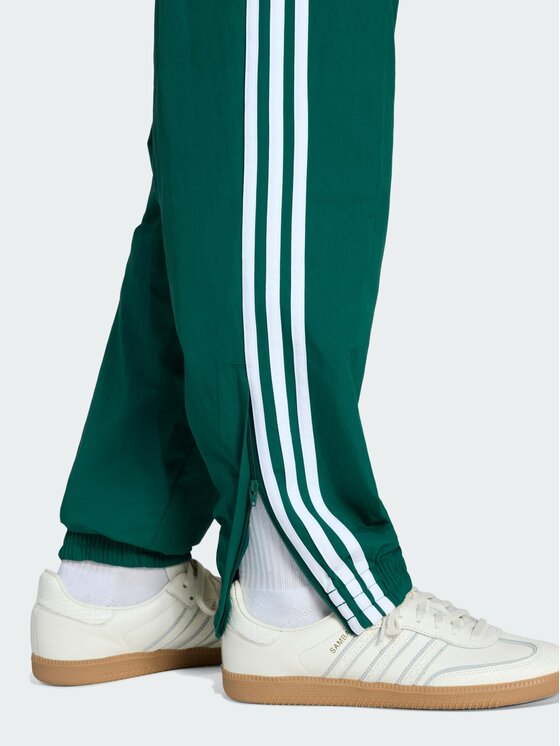 adidas adidas Spodnie dresowe FIREBIRD WOVEN Zielony Regular Fit