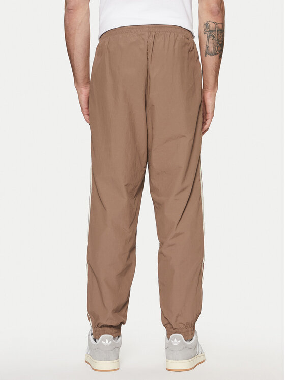 adidas adidas Pantaloni da tuta adicolor Firebird JP1024 Beige Regular Fit