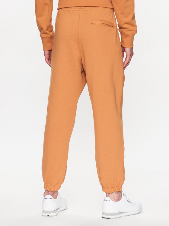 New Balance New Balance Pantaloni trening MP23551 Portocaliu Relaxed Fit