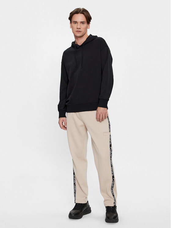 Calvin Klein Jeans Calvin Klein Jeans Spodnie dresowe Logo Tape J30J324376 Beżowy Relaxed Fit