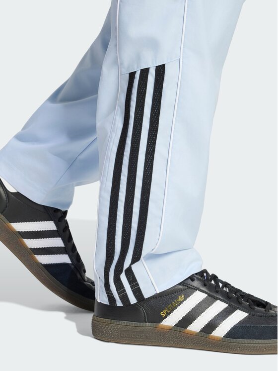 adidas adidas Spodnie dresowe HALF STRIPES Niebieski jasny Regular Fit