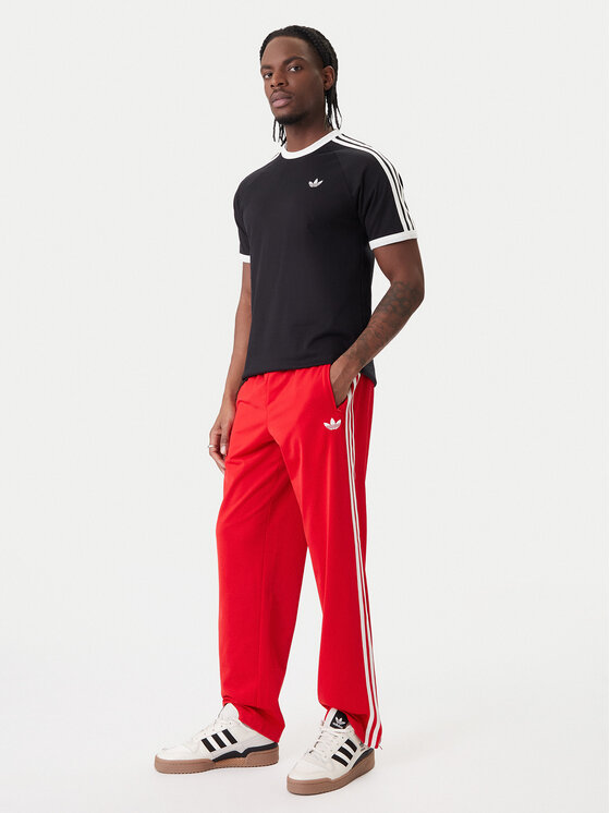 adidas adidas Donji dio trenerke Firebird KD8319 Crvena Loose Fit