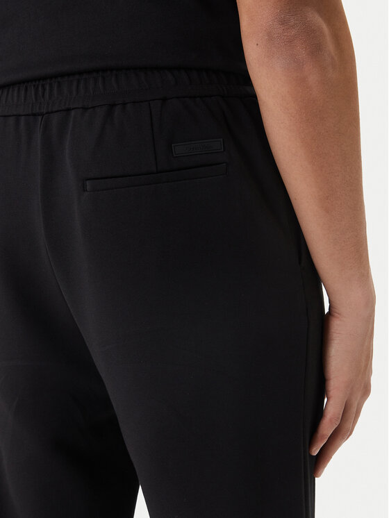 Calvin Klein Calvin Klein Riidest püksid LV04LF607G Must Tapered Fit