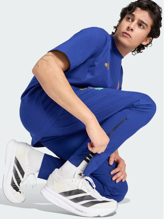 adidas adidas Spodnie materiałowe Włochy Tiro Błękitny Regular Fit