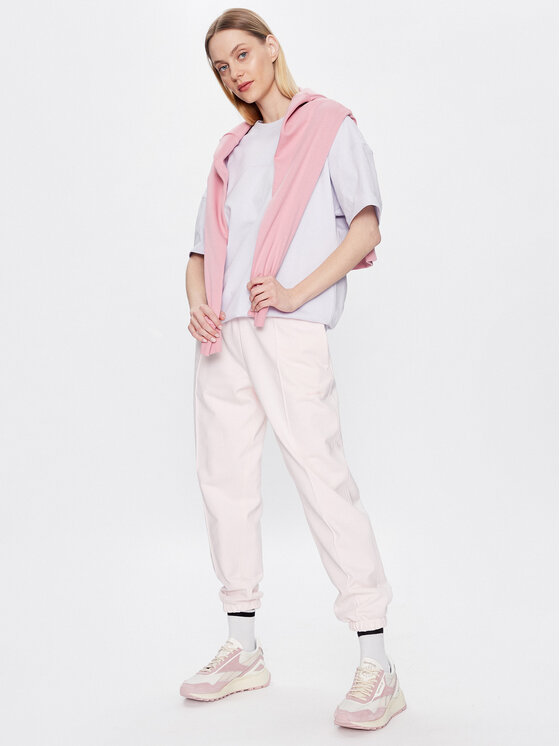 New Balance New Balance Долнище анцуг Athletics Nature WP23553 Розов Relaxed Fit