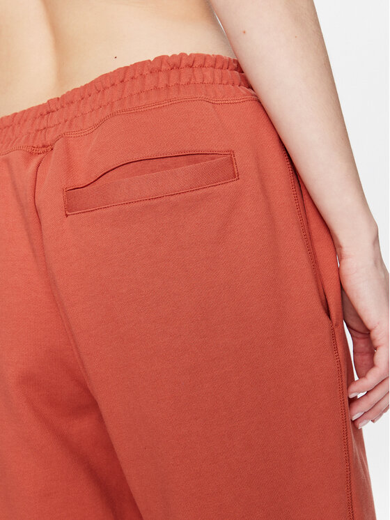 New Balance New Balance Pantaloni trening Athletics Nature WP23553 Portocaliu Relaxed Fit