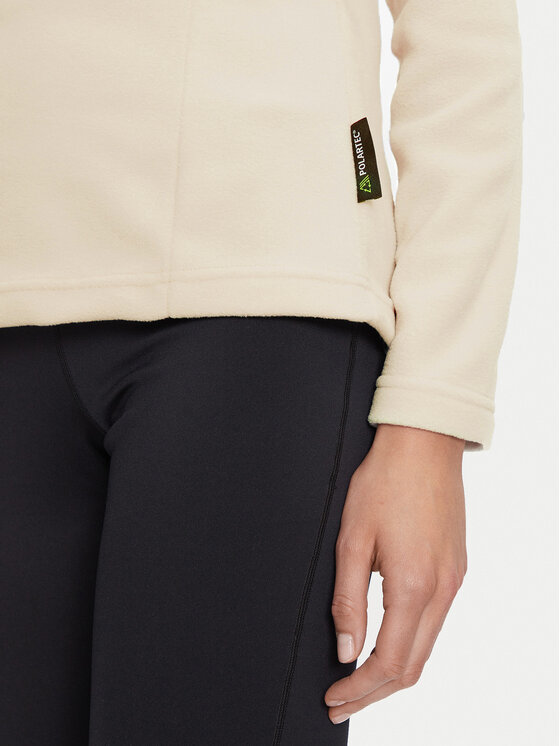 Fragment bluzy i spodni, widoczna dłoń modelki przy dolnej krawędzi bluzy.