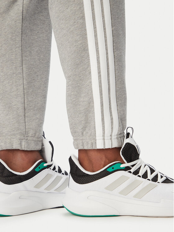 adidas adidas Dressipüksid Essentials 3-Stripes KY4195 Helehall Regular Fit