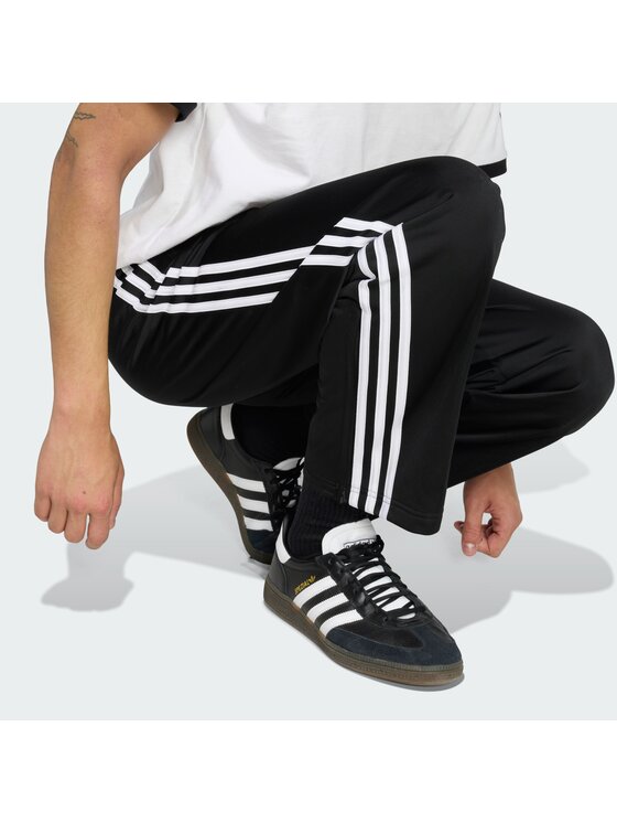 adidas adidas Spodnji del trenirke Firebird KD8315 Črna Loose Fit