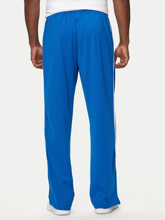 adidas adidas Спортивні штани adicolor Classics Firebird IJ7056 Голубий Regular Fit