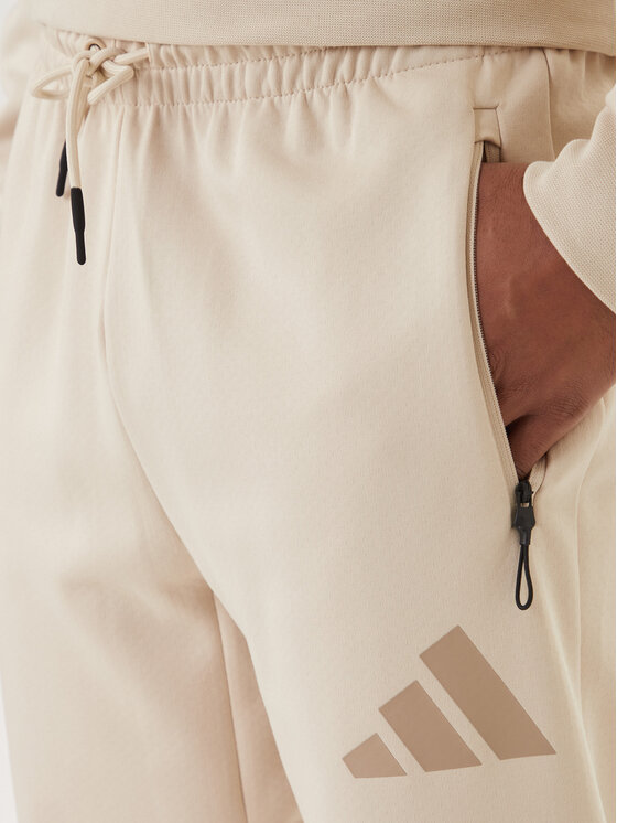 adidas adidas Spodnji del trenirke Z.N.E. KE4684 Bež Regular Fit