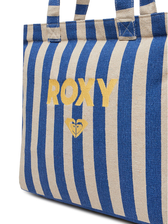 Zbliżenie na dolną część dużej torby shopper z uchwytem u góry.