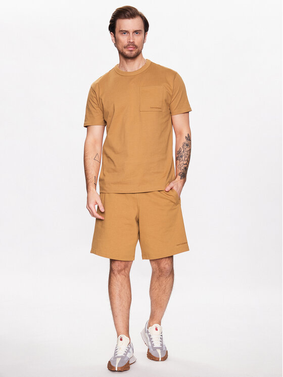 New Balance New Balance Спортни шорти Athletics MS23550 Оранжев Relaxed Fit