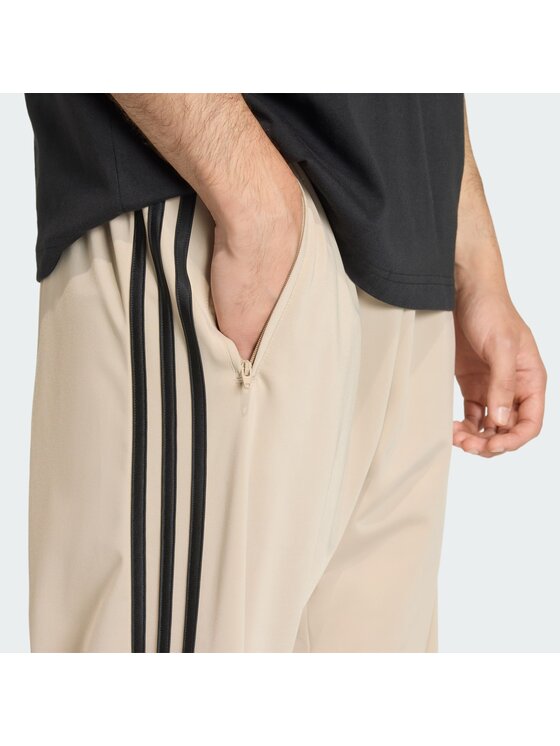 adidas adidas Παντελόνι φόρμας Firebird KE6679 Μπεζ Loose Fit