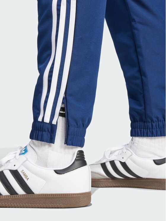 adidas adidas Spodnie materiałowe 139277 Niebieski jasny Regular Fit