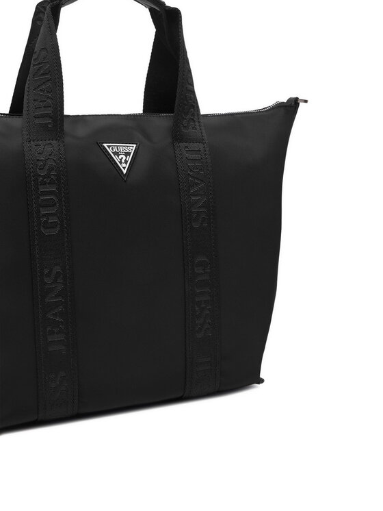 Zbliżenie na górną część torebki shopper z uchwytami.