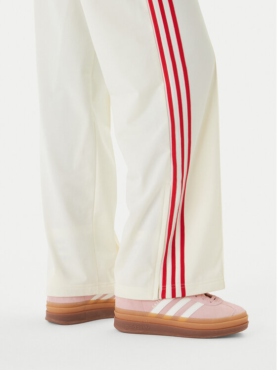 adidas adidas Spodnie dresowe Firebird KQ8056 Beżowy Loose Fit