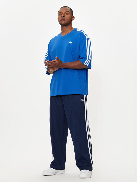 adidas adidas Melegítő alsó adicolor Firebird IZ2466 Sötétkék Baggy Fit