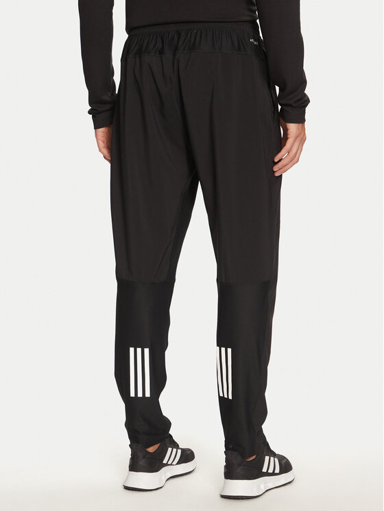 adidas adidas Donji dio trenerke Own The Run IK5024 Crna Regular Fit