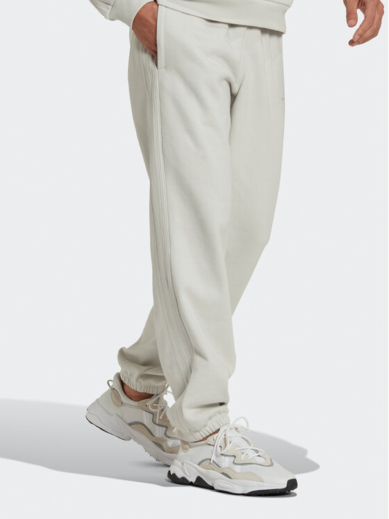 adidas adidas Spodnie dresowe Reveal Essentials HK2728 Beżowy Regular Fit