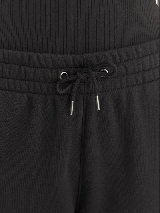 Under Armour Under Armour Donji dio trenerke UA Icon Fleece 6001537 Crna Slim Fit