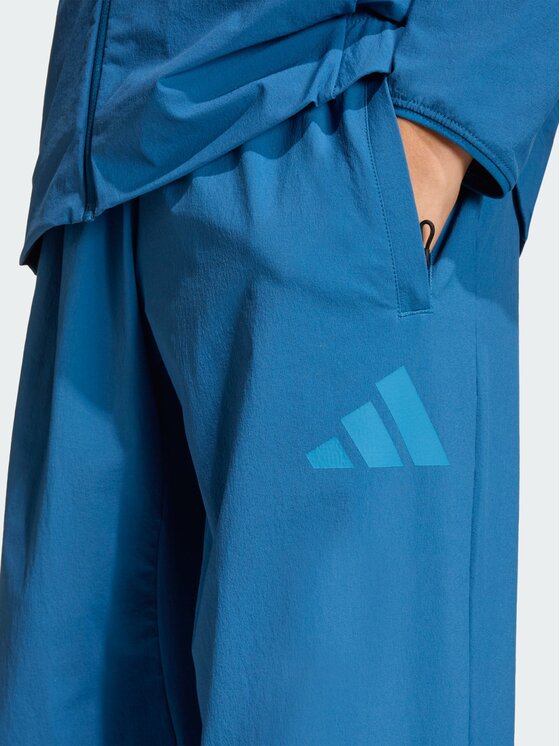 adidas adidas Spodnie materiałowe 163084 Niebieski Loose Fit